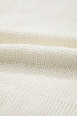 Ivory knit sweater with textured stitch detail