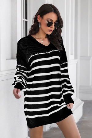 Black and white striped knit mini dress with a V-neck and long sleeves.