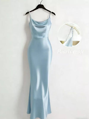 Light blue satin cowl neck maxi dress with pearl straps.