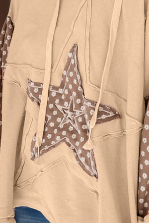 Tan hoodie with floral star patchwork and frayed details.