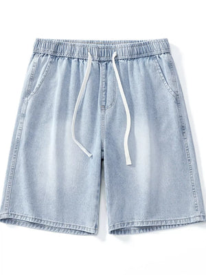 Light wash denim shorts with elastic waist and drawstring, relaxed fit.