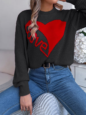 Black knit sweater with red heart and love graphic, crew neck, long sleeves.
