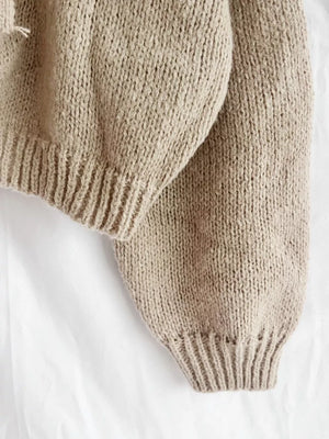 Textured knit cardigan in khaki with ribbed cuffs and hem detail.