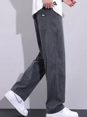 Men's grey relaxed fit sweatpants with drawstring and pockets.