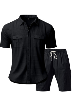 Black relaxed-fit button-up shirt with two chest pockets and drawstring shorts.