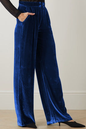 Velvet palazzo trousers in dark blue with a high waist and wide legs.