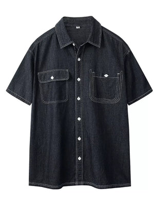 Black denim button-up shirt with white contrast stitching and two chest pockets.