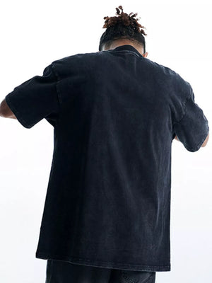 Black oversized cotton graphic tee with crew neck and short sleeves, vintage wash