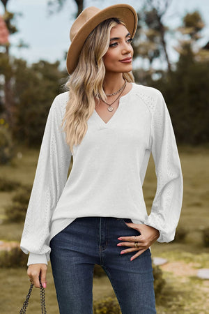 White waffle knit raglan sweater with laser cut sleeves and notched neckline