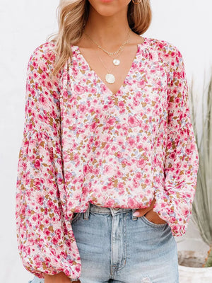 Pink floral print V-neck long sleeve maternity shirt with balloon sleeves.