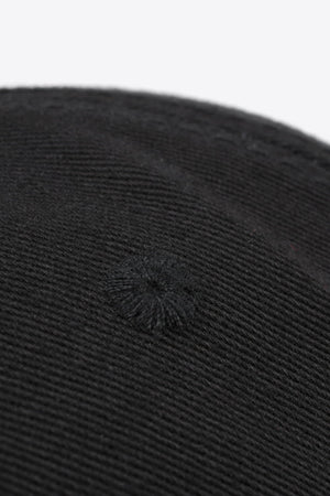 Black baseball cap with textured fabric and embroidered detail