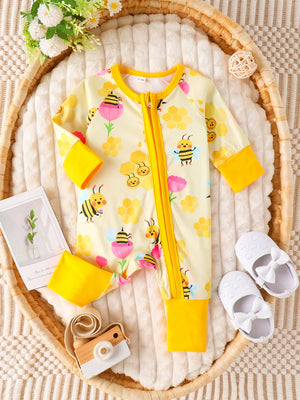 Yellow baby one-piece with bees and honeycomb print, long sleeves, zipper closure.