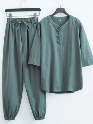 Relaxed fit Chinese-inspired men's pants set in sage green with drawstring waist and mandarin collar.