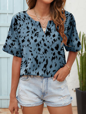 Dalmatian print relaxed notch neck top in dusty blue with short sleeves.