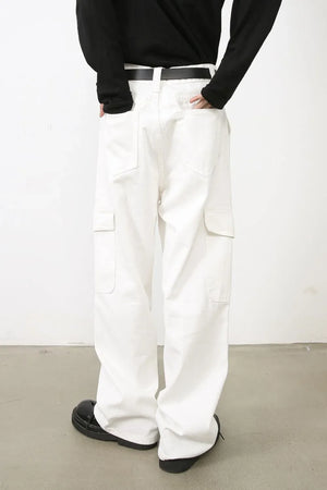 White 100% cotton wide leg cargo pants with multiple pockets.