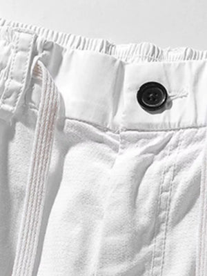 White men's cargo shorts with drawstring waist and button closure.