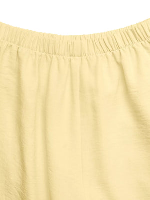 Yellow peplum hem two-piece set with button detail, elastic waistband detail.