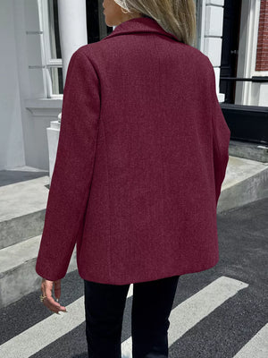 Burgundy blazer with lapel and buttoned front, shown from the back.