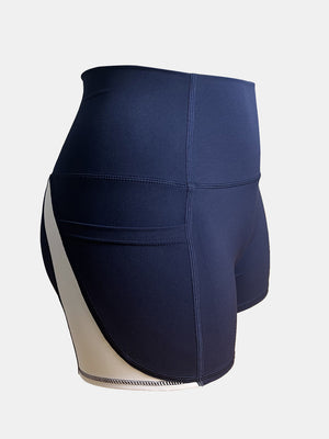 Dark blue and cream colorblock pocketed sculpt shorts with a high waist.