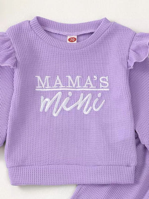 Purple waffle knit toddler top with ruffled sleeves and "Mama's Mini" embroidery.