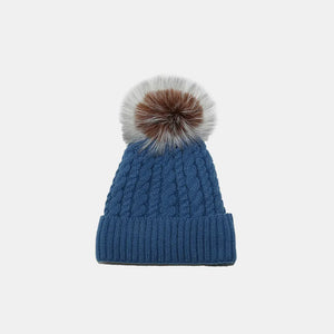 Peacock Blue cable knit acrylic beanie with a fluffy pompom.