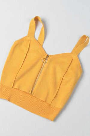 Gold ribbed knit crop top with exposed zip and ring pull detail.