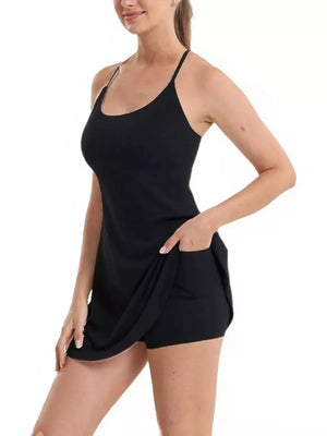Black scoop neck cami activewear set with pocketed shorts and spaghetti straps.