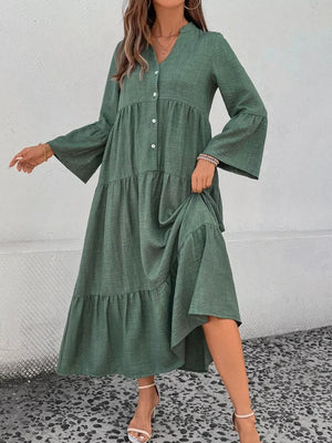 Green tiered ruffle hem v-neck dress with button front and bell sleeves.