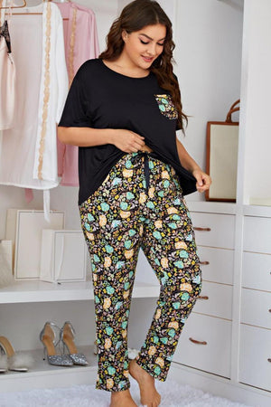 Black lounge set with botanical print pants and contrast pocket tee