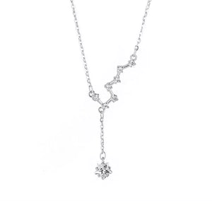 Sterling silver necklace with constellation design and star pendant.