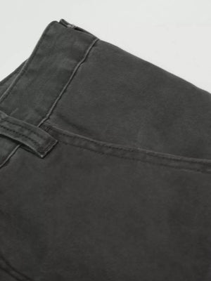 Grey relaxed fit cargo pants with utility pockets and button fly detail.