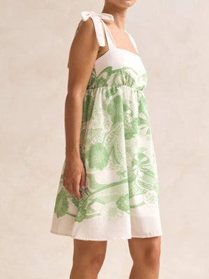Green floral tie-strap mini dress with smocked bodice and square neckline