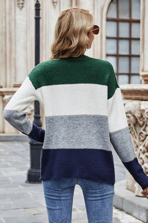 Colorblock acrylic cardigan with metallic trim in green, white, grey, and navy.