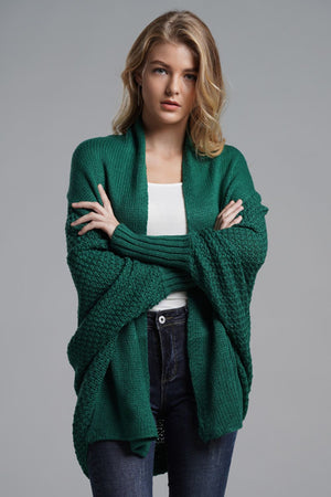 Green acrylic batwing cardigan with textured sleeves and drape front.