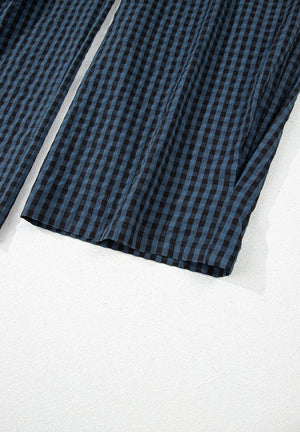 Textured dark blue gingham wide-leg overalls with button detail