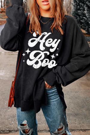 Black graphic oversized sweatshirt with "Hey Boo" print and stars, crewneck, long sleeves.