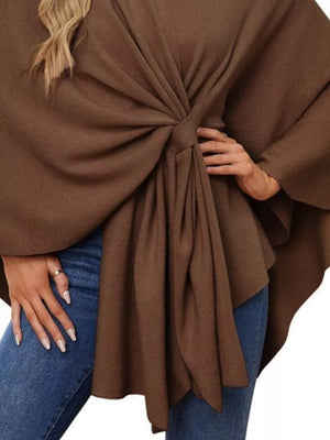 Knit cape top in caramel with a knotted tie-front and draped elegance.
