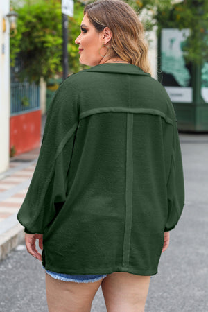 Green textured oversized button-down shirt with a herringbone pattern and dropped shoulders.