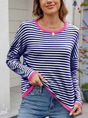 Navy and white striped knit sweater with contrast pink trim and crew neck.