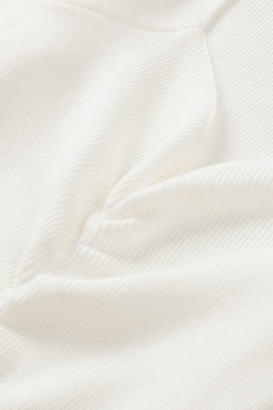 Ivory ribbed knit top with ruched front detail