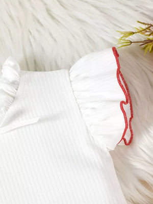 White baby top with ruffled sleeves and red trim detail.