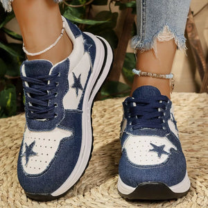 Blue denim sneakers with white star details and chunky soles.