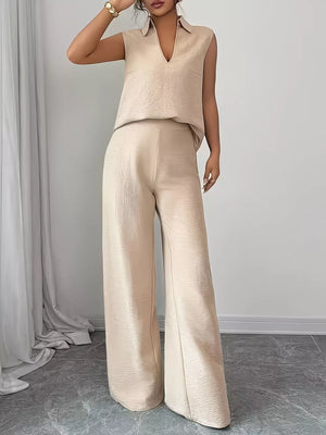 Beige sleeveless collared top and wide-leg pants set with textured fabric.
