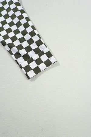 Olive and black checkered button-down shirt sleeve detail