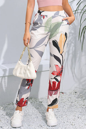 Botanical print slim-fit trousers in floral pattern with a casual, chic style.