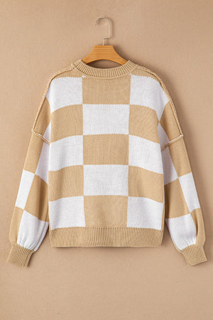 Checkerboard knit relaxed crewneck sweater in tan and white with balloon sleeves.