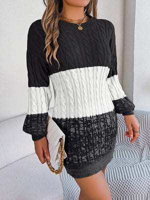 Colorblock cable knit mini dress in black, white, and grey acrylic with crew neck.