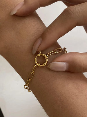 Gold chunky link bracelet with circular clasp detail