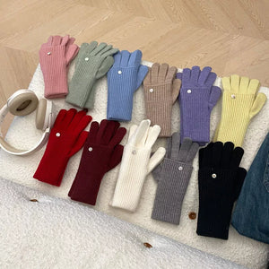 Convertible ribbed knit gloves in multiple colors with a button detail.