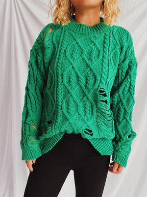 Green distressed cable knit sweater with ripped details and crew neck.